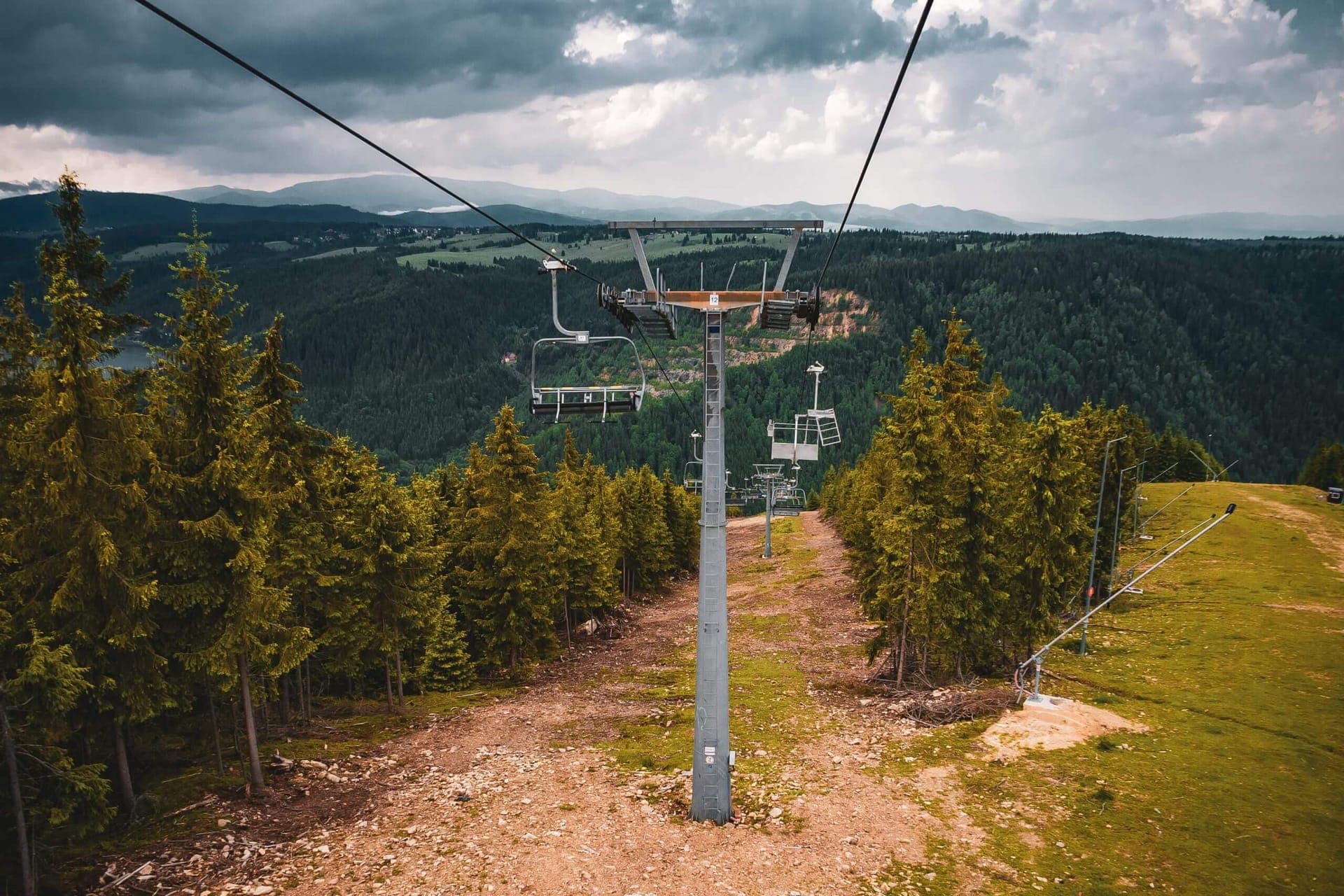 Chair lift over forested hills