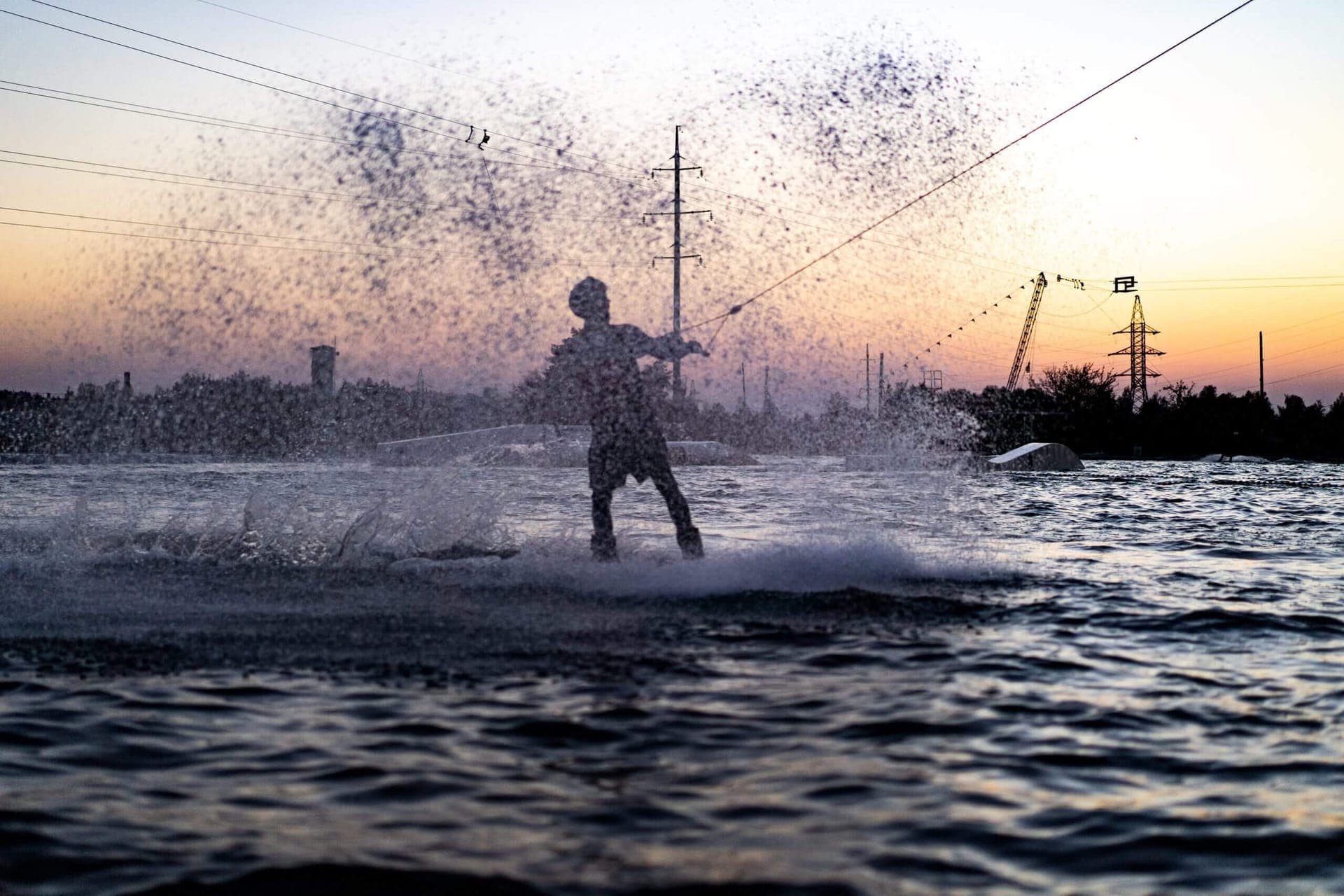 Wakeboarder jumping a wave