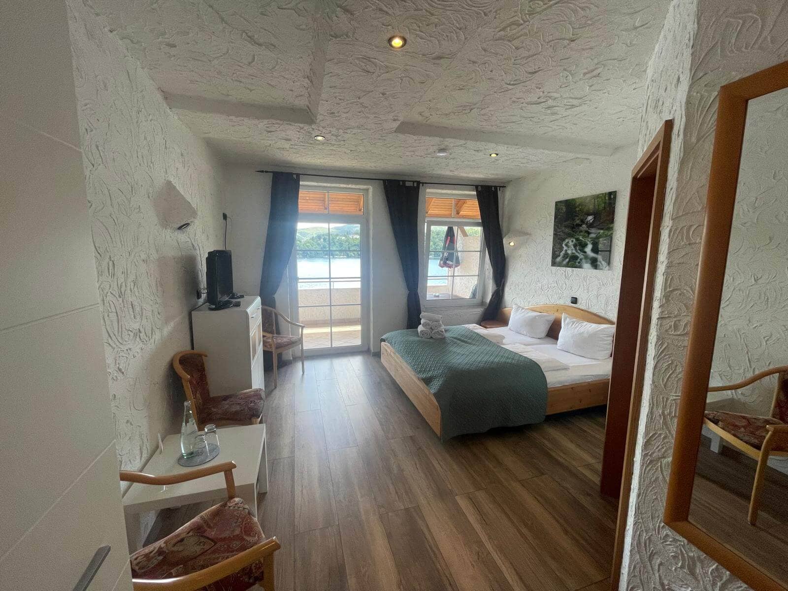 Comfortable hotel room with views over Lake Edersee