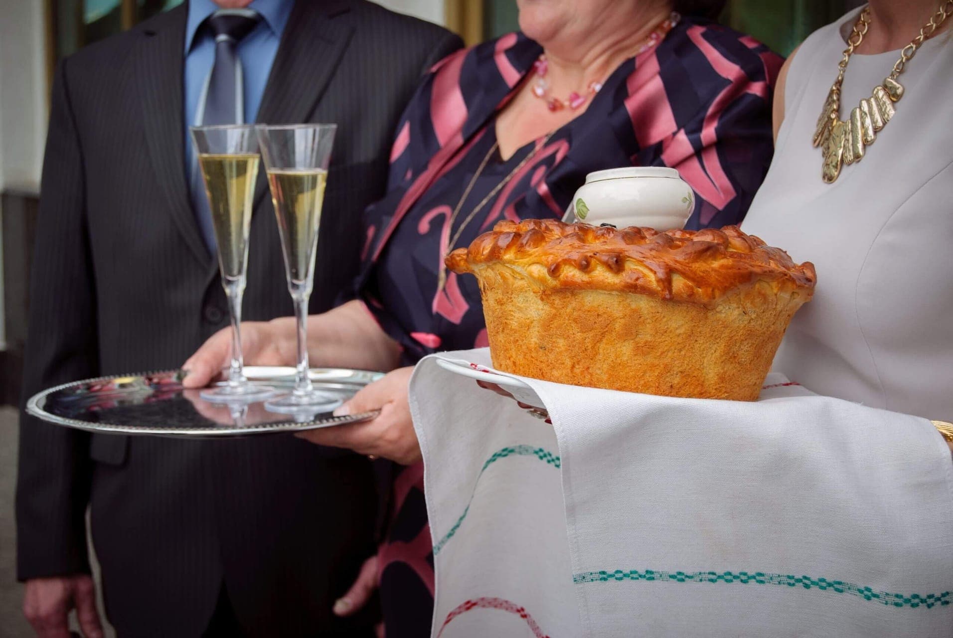 Festive tradition with bread held over a wedding couple
