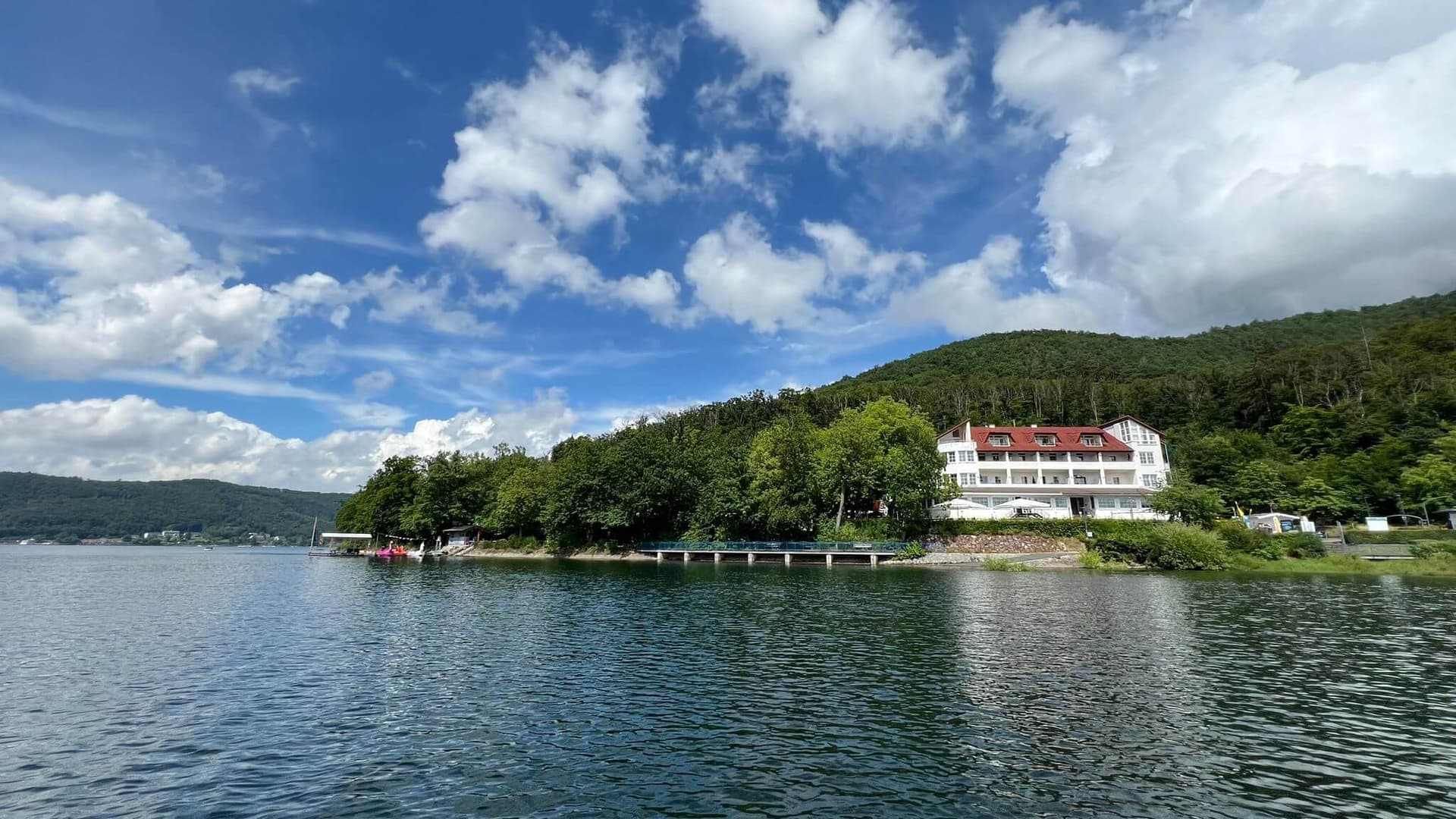 Exterior view of the hotel and terrace on Lake Edersee